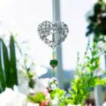 Crystal suncatcher detail shot showing heart tree of life pendant with green crystal beads. - Green Tree of Life with 20 Balls