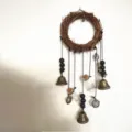 Bohemian twig wreath hanging bell wall decor with glass bottle and pentagram ornament - Three Bottles