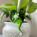 Detailed view of a funny green frog resin hanging ornament for plant pots and home decor. - Right-Hanging