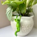 Green frog resin figurine detail shot, creative bonsai pot hanging ornament for home garden decor. - Front-Hanging