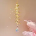 Detailopname van gouden spiraal zonnevanger met sprankelende kristallen ballen en regenbooglichteffect. - Goud AB kleur