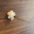 Exquisite handmade glass flower variant with white orange-spotted petals and green stem. - January - Carnation