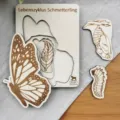 Wooden butterfly life cycle puzzle detail shot, educational insect growth tray display. - Butterfly