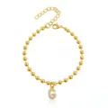 Bracciale di perline dorate con ciondolo lettera G in strass scintillanti,bijou chic. - Braccialetto a Sfere Iniziale B con Strass / Oro