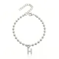 Bracciale di perle in acciaio inossidabile con ciondolo lettera H in strass e catena di estensione. - Braccialetto a Sfere Iniziale H con Strass / Argento