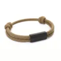 Close-up view of hand-woven paracord bracelet detail with sleek black metal tube clasp. - 2cm Square Tube Paracord Style / Brown Cord Black Accessories