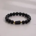 Close-up detail of natural black obsidian beaded bracelet with gold spacer and central stone. - Tourmaline Obsidian Beaded Bracelet / 10MM/1 Piece