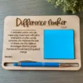 Wooden sticky note holder with engraved motivational quote and pen, detail shot. - Personalized Variety Memo Pads