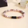 Detailed shot of fashion pink zebra stone and tourmaline beaded bracelet with gold spacers. - Pink Zebra Tourmaline Bracelet