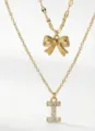 Collana a strati dorata con fiocco e ciondolo lettera in zircone gioiello da donna - Stile a Doppio Strato con Lettera Iniziale I e Fiocco / Oro