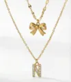 Collana a doppio strato dorata con fiocco e ciondolo con lettera N in strass donna - Set da 2 pezzi - Stile Fiocco Lettera N / Oro