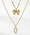 Collana a doppio strato dorata con ciondolo a fiocco e lettera O in strass gioielli - Set da 2 pezzi - Stile Fiocco Lettera O / Oro