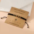Morse code number 2 braided bracelet with gold tone stainless steel beads and handmade card. - Morse Code 2 Black Flat Knot Bracelet with Card