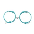 Gedetailleerd overzicht van turquoise gevlochten touw armband met magnetisch hart. - Hart Meerblauw Paar