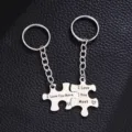 Detailed shot of stainless steel puzzle couple keychains with romantic I love you engraving. - I Love You Most Style / 2PCS / Silver