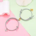Detail shot of matching magnetic couple bracelets with grey braided rope and cute heart locks. - Magnetic Heart Pair / 1 Pair / Gray