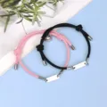 Couple magnetic braided bracelet set with stainless steel tag and heart charm details. - Magnetic Heart Stainless Steel Bar Black and Pink Pair