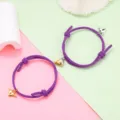 Couple magnetic attraction woven bracelet set detail showcasing the metal heart charms and purple rope. - Magnetic Heart Pair / 1 Pair / Purple