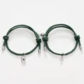 Close-up detail of green rope couple magnetic bracelets with metal lock and key charms display. - Key Lock Dark Green Pair