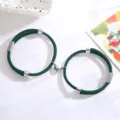 Groene gevlochten koppel armbanden met magnetische hartsluiting en zilveren metalen buizen detail. - Donkergroen Hart Stijl / Eén paar