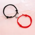Couple magnetic heart bracelet set, black and red braided rope matching jewelry detail view. - Minimalist Black and Red Pair
