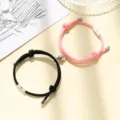 Close-up view of the magnetic couple bracelet clasp and braided rope texture details. - Milan Cord Sun Moon Black and Pink Pair