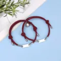 Stainless steel magnetic couple bracelets set with braided rope and heart pendant design. - Magnetic Heart Stainless Steel Bar Wine Red Pair