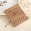 Colorful braided wish bracelet with golden bead on craft paper card, adjustable string. - Red (F5)