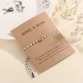 Minimalist braided cord wish bracelet with golden bead on wish card, adjustable handmade jewelry. - Black and White (F9)