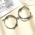 Magnetic couple braided bracelets with sun and moon matching design for best friends and lovers. - Milan Cord Sun Moon Gray Pair