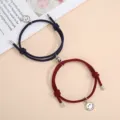 Close up detail of handmade woven couple magnetic attraction smiley face bracelets in dark blue and red. - One Pair / Dark Blue and Wine Red