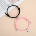 Handmade woven couple magnetic matching bracelets with cute metal smiley face charms. - One Pair / Black and Pink