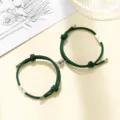 Green magnetic couple bracelets set with sun and moon charm matching braided rope jewelry detail - Milan Cord Sun Moon Dark Green Pair