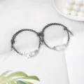 Bracelets magnétiques tressés de couple avec pendentif menottes vue détaillée excellente qualité. - Menottes Nouvelle Corde Noir et Blanc Paire