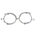 Couple magnetic bracelet set detail view, featuring grey woven rope and alloy charms. - One Pair / Gray