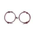Close-up detail of matching couple magnetic heart woven bracelets in dark red color. - Wine Red Pair