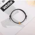 Black and white braided rope bracelet detail showing metal bead and unique design. - Gold Tungsten Carbide Bracelet (Metal End) / Black and White