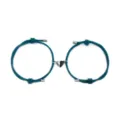 Close-up detail of couple magnetic heart bracelet set with dark teal woven rope and half black silver charm. - Peacock Blue Pair