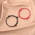 Matching couple magnetic bracelets with black and red woven ropes and a cute heart charm. - Black and Red (Pair) / Black And Red