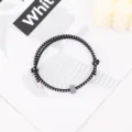 Black white woven survival bracelet with metal ends and tungsten bead for outdoor wear - Tungsten Carbide Bracelet / Black and White