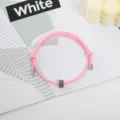 Pink woven cord bracelet with tungsten carbide bead and metal tips, detailed view showcasing style. - Tungsten Carbide Bracelet (Metal End) / Pink