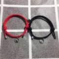 Set di bracciali di coppia in corda intrecciata magnetica con ciondolo onda rosso e nero. - Un paio / Nero + Rosso