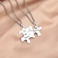 Detailed close-up of interlocking puzzle couple necklaces made of stainless steel with engravings. - Stainless Steel Chain Pair / Puzzle Necklace Model B (I'll be back/waiting)