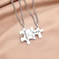 Stainless steel puzzle couple necklace detail view with engraved forever and always words. - Puzzle Necklace Model E (Forever/Always)