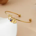 Bracelet jonc en acier inoxydable doré avec pendentif cœur et pierre bleue bijou tendance - Or / Pierre de Naissance de Septembre