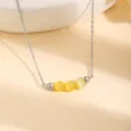 Collier de chaîne en acier inoxydable avec perles d'œil de chat jaunes et détails argentés. - Pierre œil de chat jaune / 1 Pièce / Argent