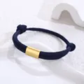 Minimalist dark blue paracord bracelet with a sleek gold stainless steel tube centerpiece. - Navy Blue Paracord