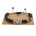 Handmade woven beaded bracelet with football charm and letter beads for sports fans. - 8MM Black Shiny Beads Football Letter Bracelet / Letter A