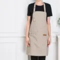 Khaki canvas kitchen work apron with adjustable neck strap, durable chef apron for cooking. - Khaki