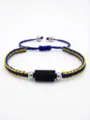 Bracciale intrecciato blu e giallo fatto a mano con tormalina nera regolabile. - blu e giallo
